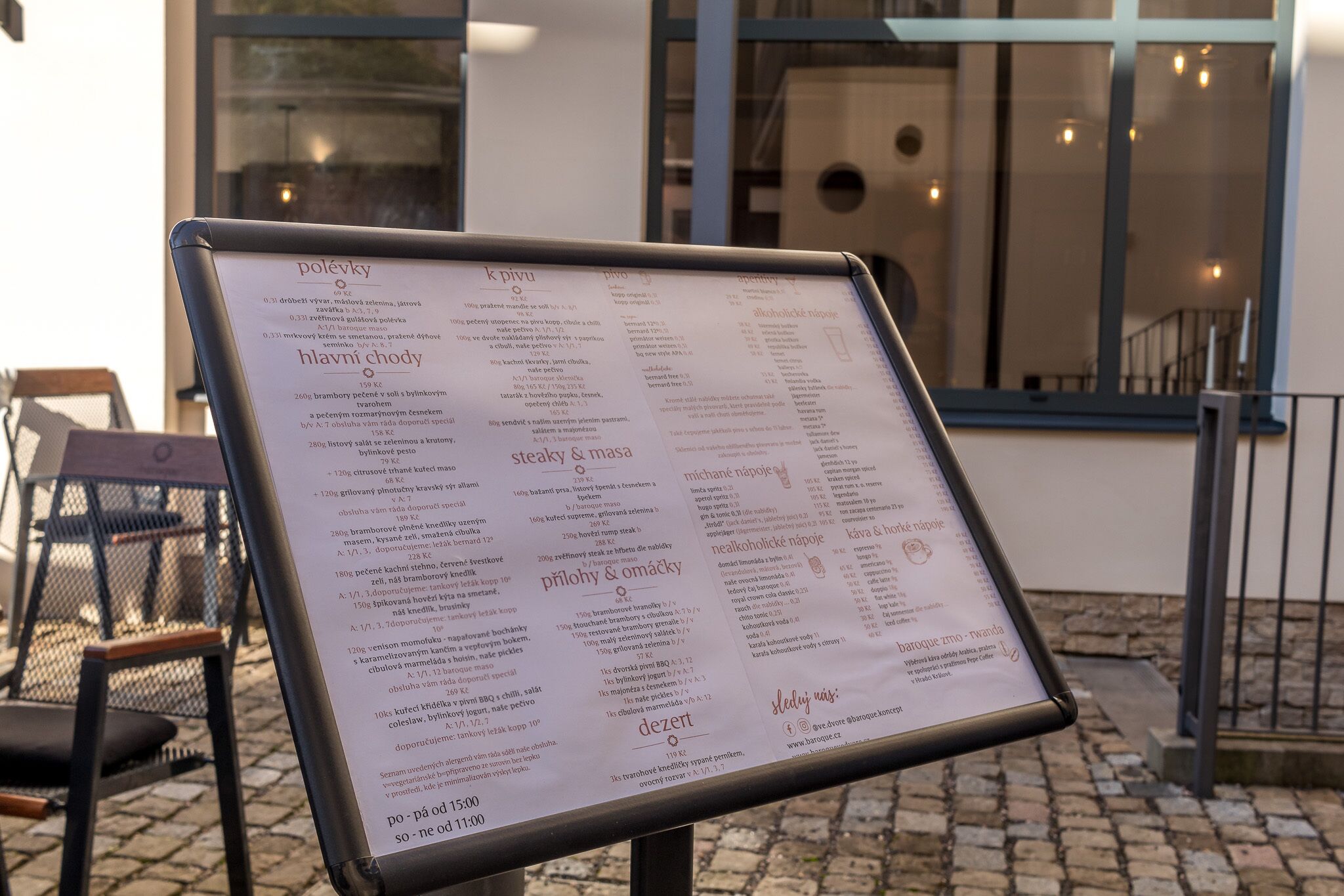 A menu board with various food items and prices in a restaurant.