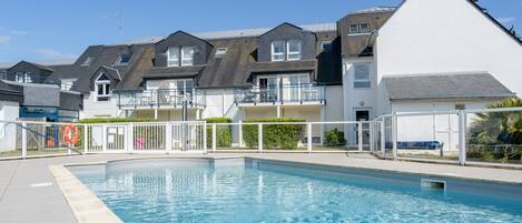 Seasonal outdoor pool, open 10 AM to 7:00 PM, pool umbrellas