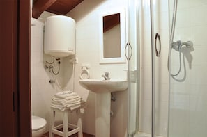 Suite, 1 King Bed | Bathroom | Shower, free toiletries, hair dryer, towels