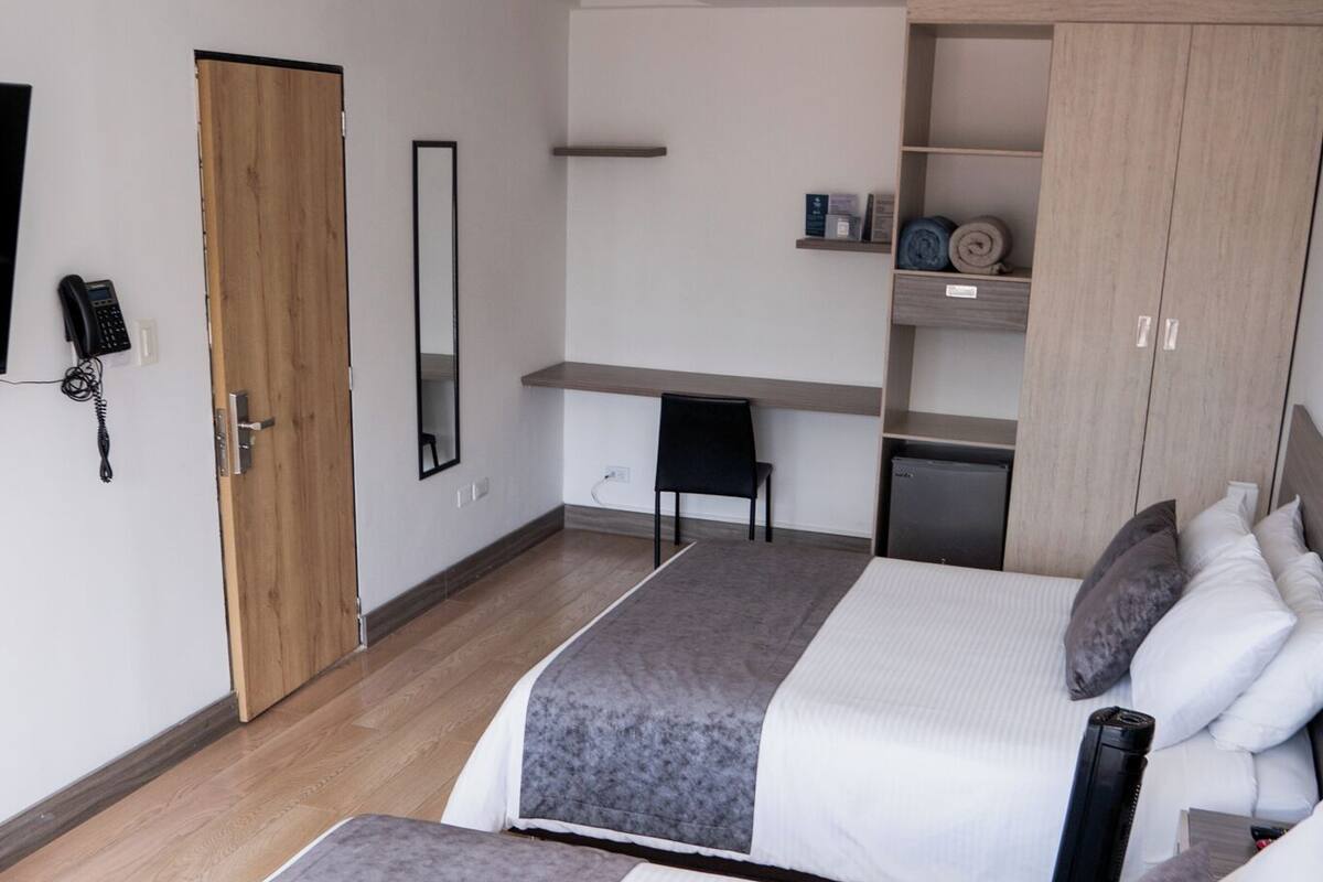 Standard Triple Room, 2 Queen Beds, Private Bathroom | In-room dining