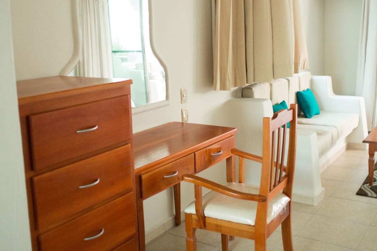 studio suite, 2 queen beds, sea view, oceanfront | living room | 49-inch flat-screen tv with digital channels