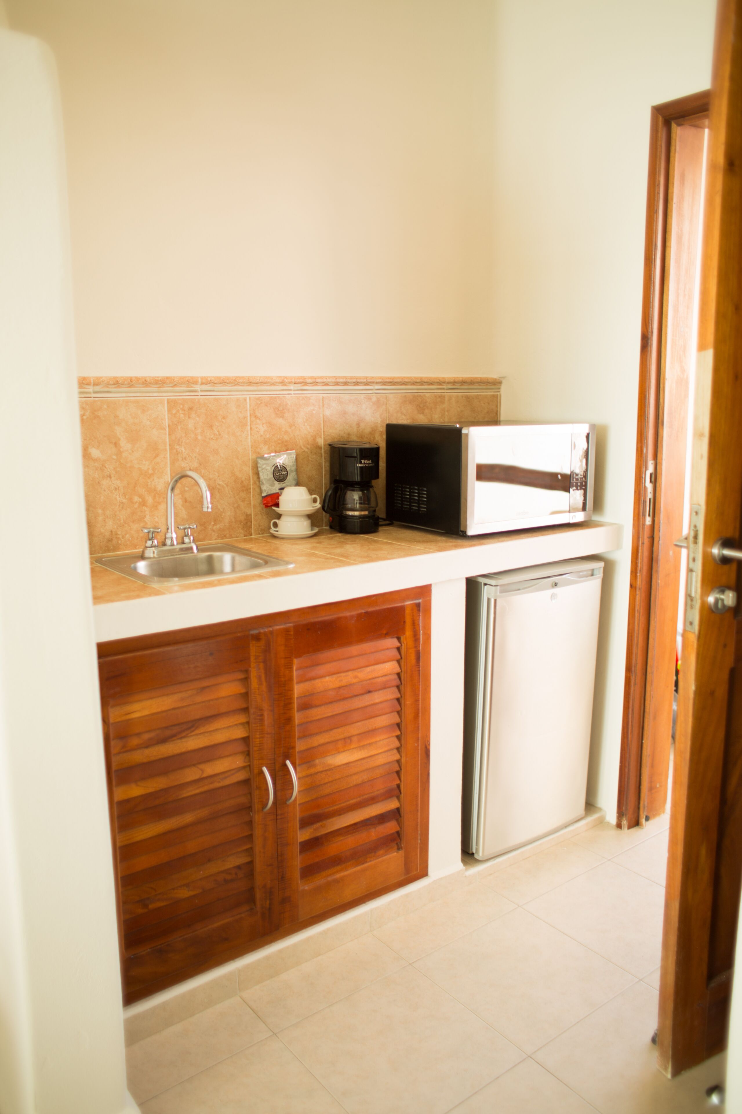 standard double room, 2 queen beds, ocean view, beachfront | living area | 49-inch flat-screen tv with digital channels