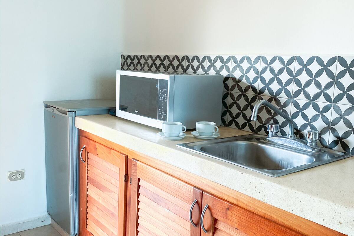 double room, 1 king bed, ocean view, beachfront | private kitchenette | coffee/tea maker, kitchen islands