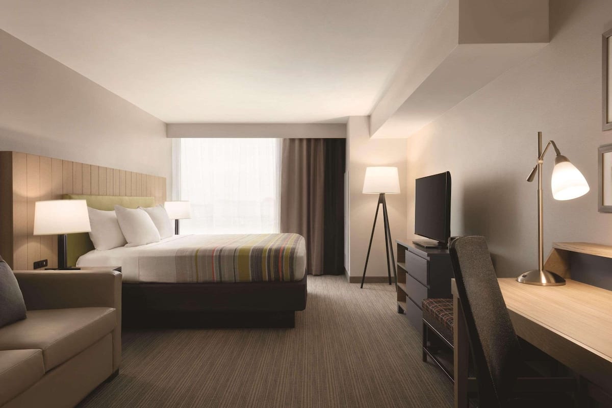 Studio Suite, 1 King Bed, Non Smoking | Desk, laptop workspace, blackout drapes, soundproofing