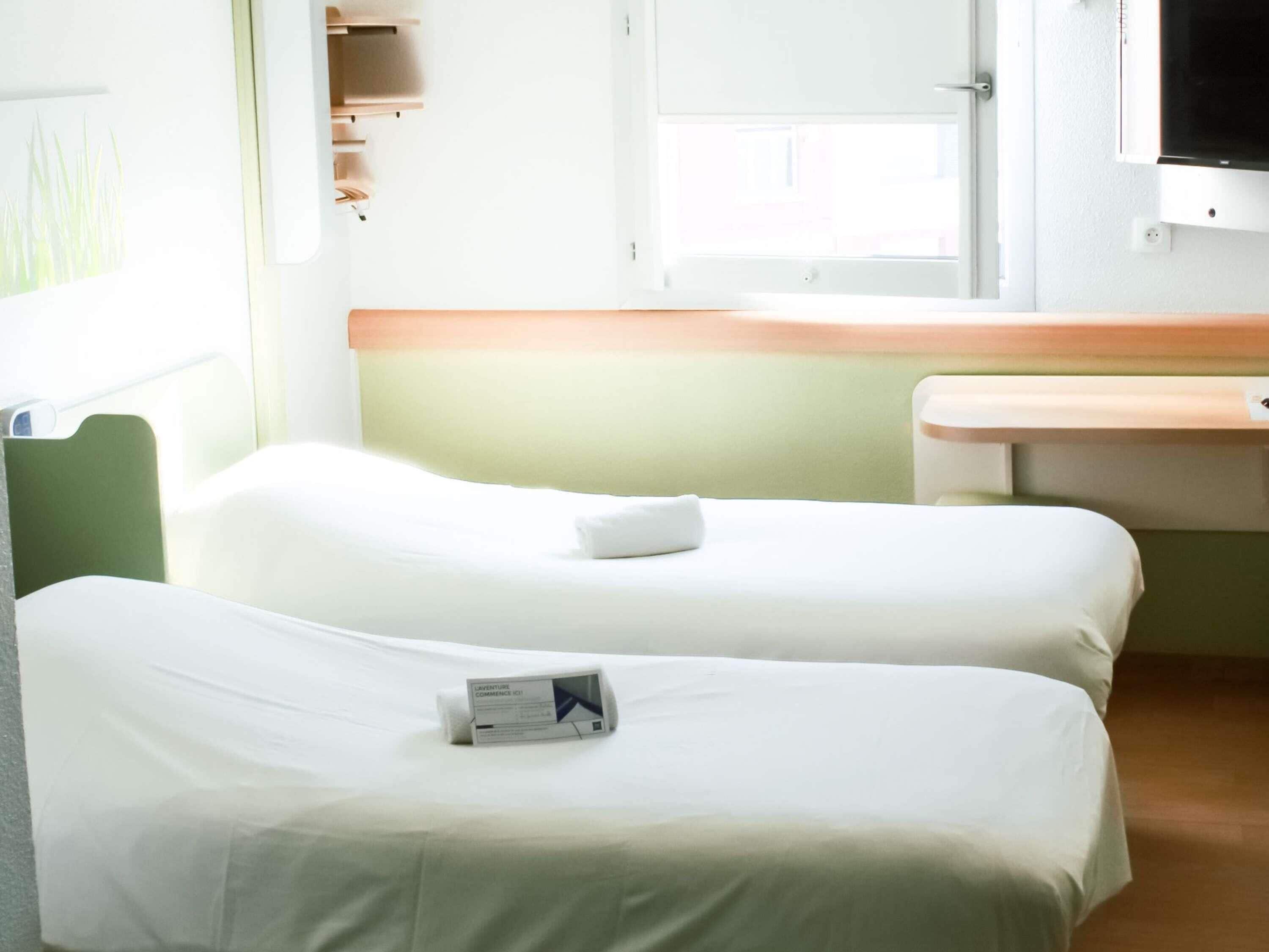 Chambre avec lits jumeaux, 2 lits une place | Wi-Fi gratuit