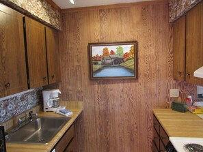 Fridge, microwave, coffee/tea maker, cookware/dishes/utensils