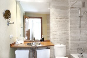 Bathtub, hair dryer, towels