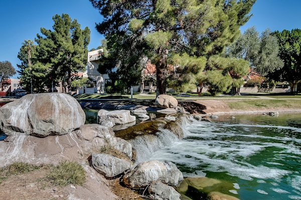 Enjoy the community waterfall as you stroll around the lake