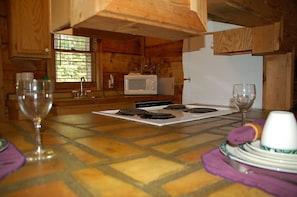 Microwave, dishwasher, coffee/tea maker, cookware/dishes/utensils