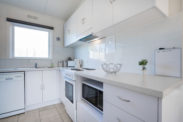 Premium Apartment, 2 Bedrooms | Private kitchen | Full-size fridge, microwave, oven, stovetop