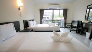 A hotel room with two beds, a desk, and a balcony with curtains. - Memory Place (Krabi)