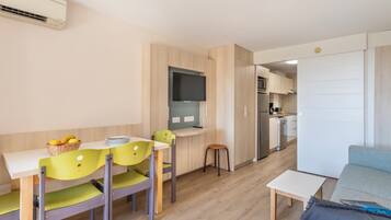 Standard Studio, Terrace | Living area | 70-cm LCD TV with digital channels, TV, books