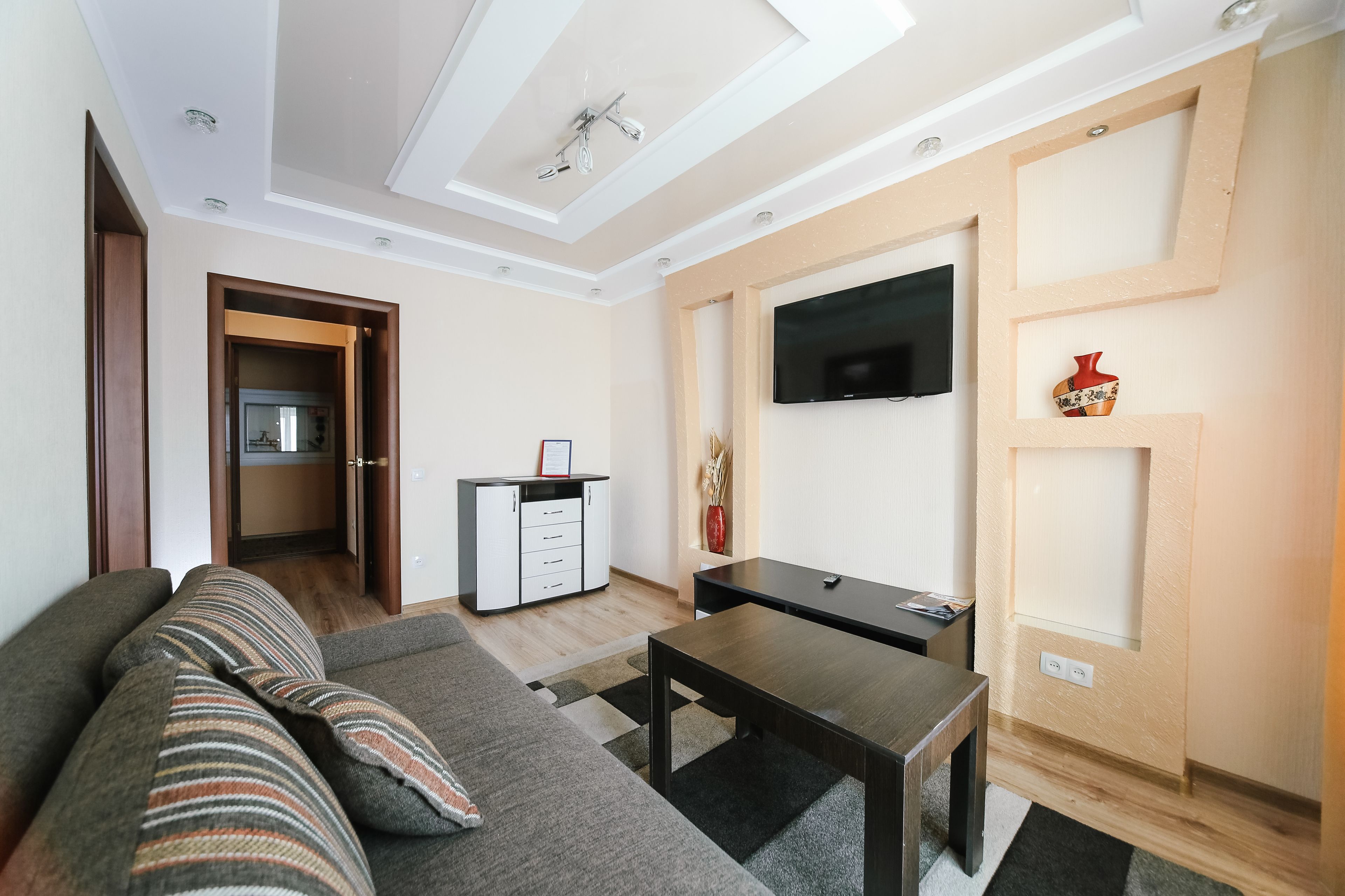 Superior Suite, 1 Bedroom | Living room | 60-inch TV with cable channels