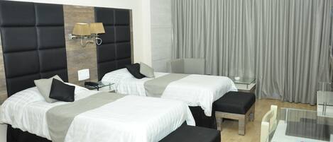 Executive Room (Non AC) | Blackout curtains, soundproofing, rollaway beds, free WiFi