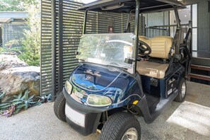 A golf cart with a license plate and a sign indicating it is for use only. - Shorelines 27 Hamilton Island 2 Bedroom Ocean View Near Marina With Golf Buggy (Whitsundays)