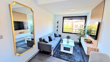 Deluxe maisonnette, 1 slaapkamer, in toren | Woonruimte | Smart-tv