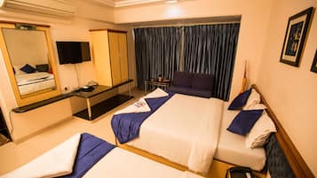 Deluxe Triple Room | Individually furnished, blackout drapes, iron/ironing board, free WiFi