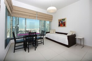 Apartment, 1 Bedroom (2204) | Living room | LED TV - New Arabian Holiday Homes - Loft Central (Dubai)