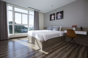 Deluxe Suite, 1 King Bed, Park View | In-room safe, desk, soundproofing, iron/ironing board - NTA Hotel - Serviced Apartments (Ho Chi Minh City)