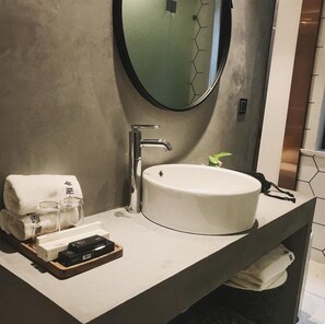 A modern bathroom with a round sink, a mirror, and a towel rack. - Suzhou Cloud Art Inn (Suzhou)
