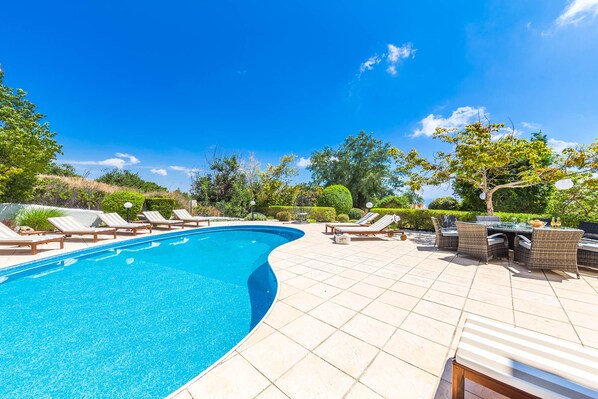 Outdoor pool, pool umbrellas, pool loungers