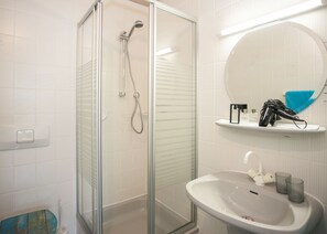 Hair dryer, towels, toilet paper