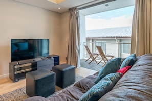 Standard Apartment, 1 Bedroom | Living area | Flat-screen TV