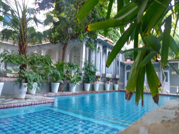 Outdoor pool, open 10:30 AM to 7:00 PM, pool umbrellas, sun loungers