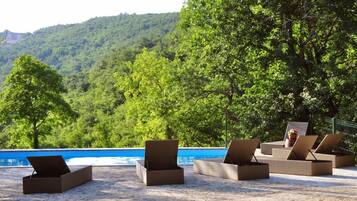 Seasonal outdoor pool, pool loungers