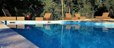 Seasonal outdoor pool, pool loungers