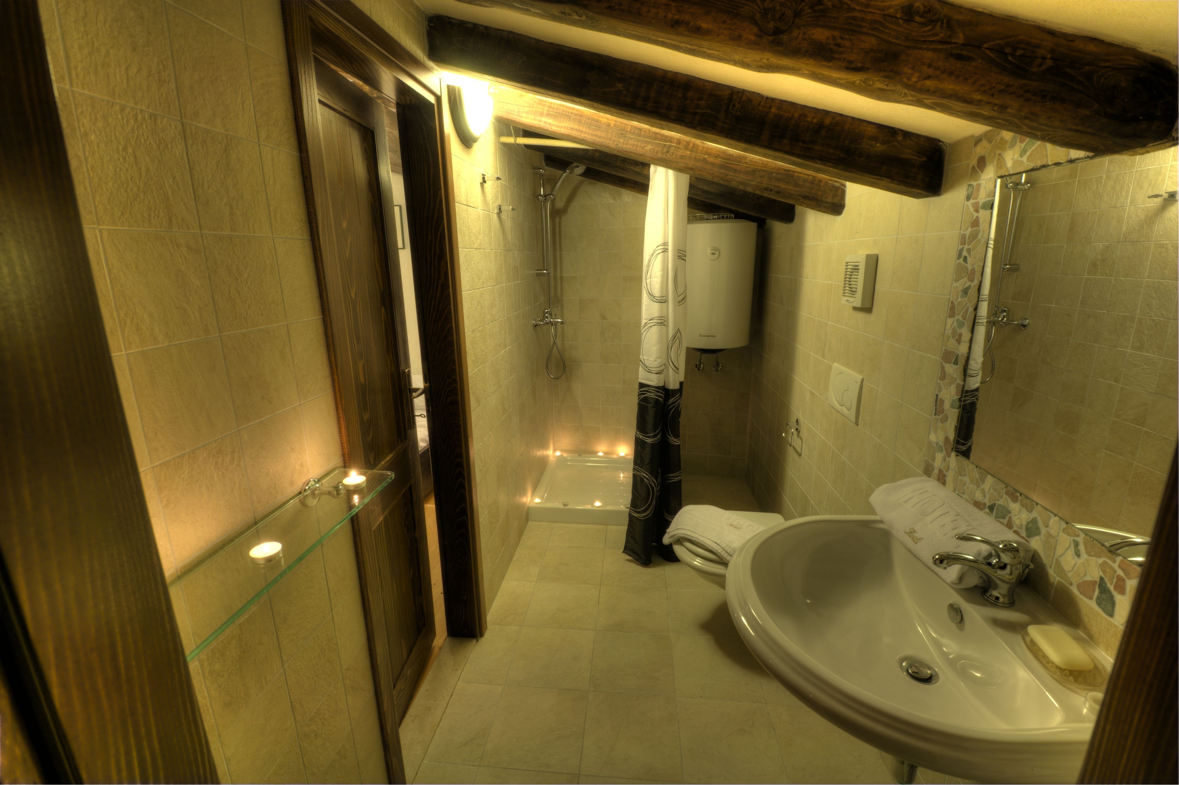 A bathroom with a bathtub, a sink, and a shower.