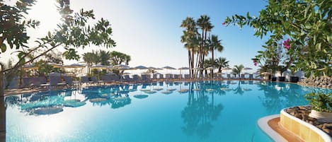 5 outdoor pools, open 10 AM to 6 PM, pool umbrellas, sun loungers