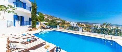 Outdoor pool, pool umbrellas, pool loungers