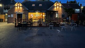 A brick building with a restaurant named "The Grey Horse" at its entrance. - The Grey Horse (Darlington)