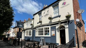 A traditional pub with a signboard advertising live craft beer and a dartboard. - The Grey Horse (Darlington)