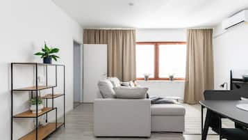 Appartement, 2 chambres (A1) | Coin séjour | Télévision à écran plat