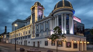 A historic theater with a prominent dome and columns, featuring the name 'Alhambra' on its facade. - The Grand Mill (Bradford)