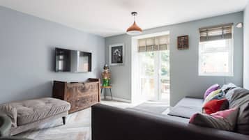 Apartment, 4 Bedrooms | Living area | Flat-screen TV