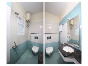 A bathroom with a toilet, sink, and shower. - Capital O 14043 Hotel Star Holiday (Chennai)