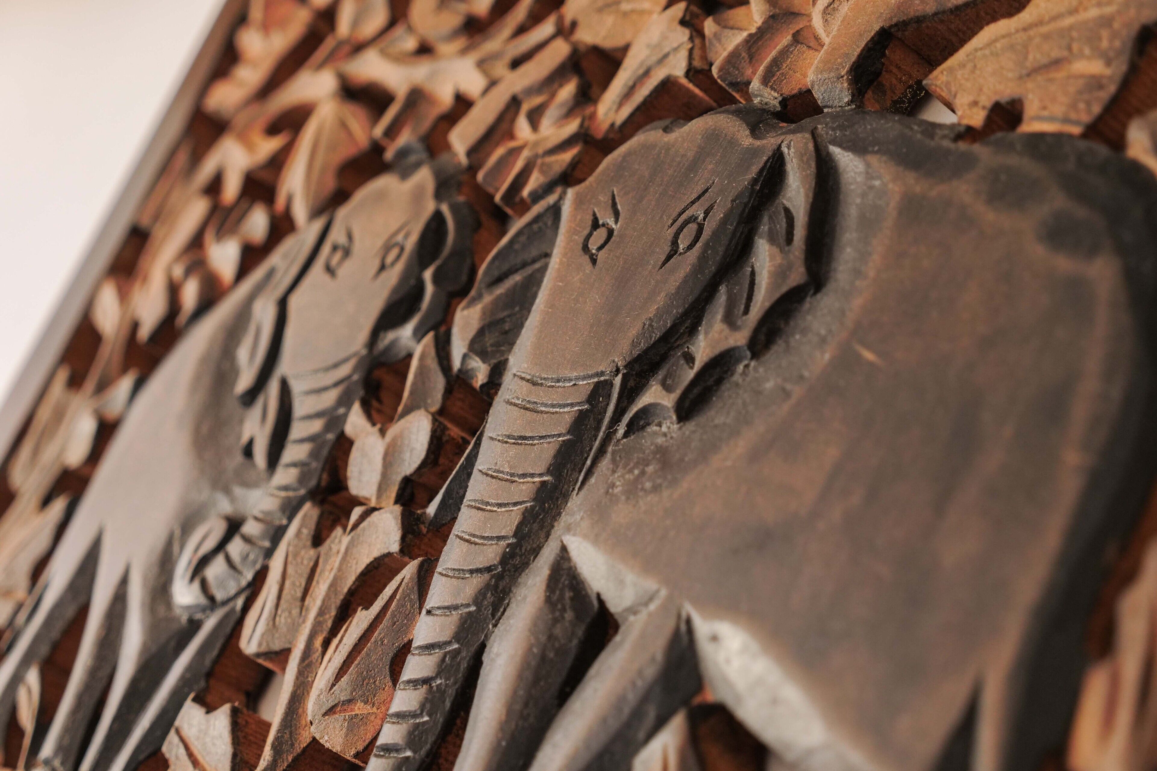 A close-up of a wooden sculpture with intricate carvings.