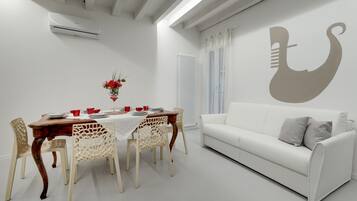 Apartment, 2 Bedrooms, Mimosa | Living area | Flat-screen TV