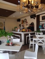 Breakfast, lunch, dinner served; local cuisine 