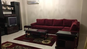 Comfort Apartment, 3 Bedrooms | Living area | 45-inch LED TV with satellite channels - Chez Lay (New Cairo)