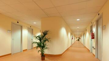 Desk, laptop workspace, iron/ironing board, cribs/infant beds