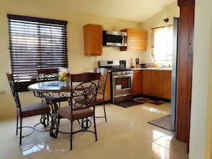 Comfort House, 1 Queen Bed | Private kitchen | Full-size fridge, microwave, oven, stovetop