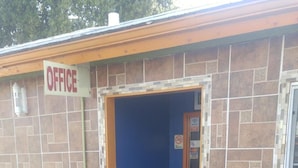 A small building with a sign labeled "OFFICE" at the entrance. - Travel Eagle Inn Motel (Long Beach)