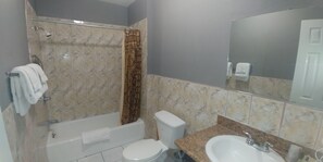 Basic Room, 1 King Bed | Bathroom | Combined shower/tub, free toiletries, hair dryer, towels
