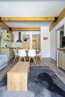 Apartment, 1 Bedroom (Mountain Side) | Living area | Flat-screen TV