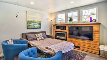TV, fireplace, books