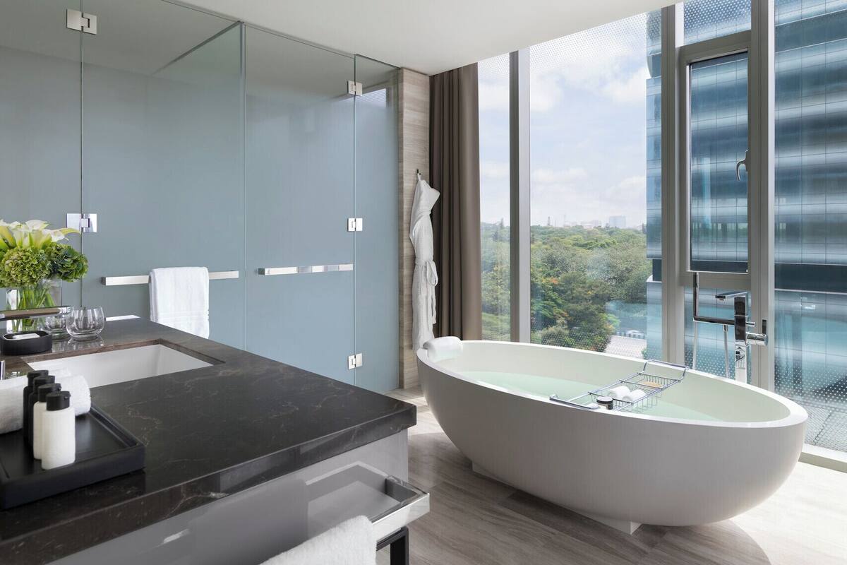 club room king | bathroom | separate bathtub and shower, deep-soaking bathtub, rainfall showerhead